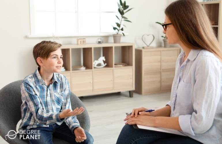 psychologist listening to a young patient during therapy session