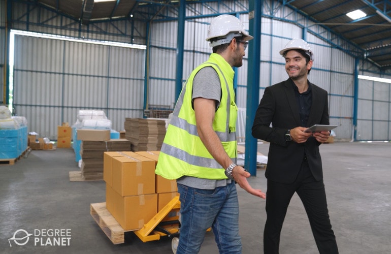 Supply chain manager talking to a worker