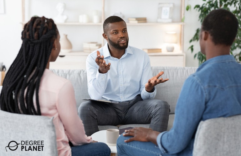 marriage counselor with couple during therapy session