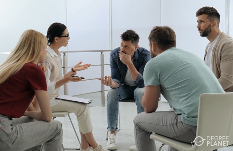 Rehabilitation Counselor with a group of people during counseling