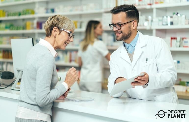 Pharmacist discussing with elderly client