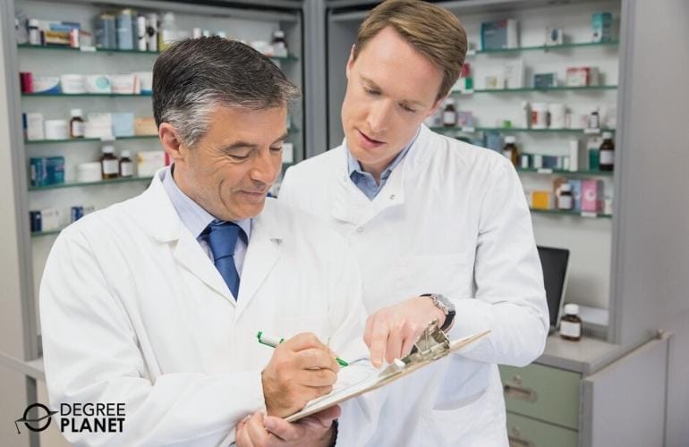 Pharmacist and Pharmacy Technician reviewing medicine orders