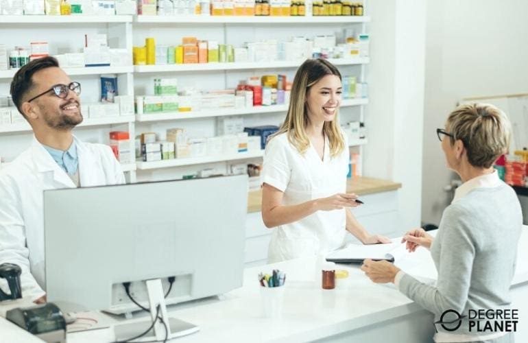 Store's Pharmacy Technician discussing with a customer