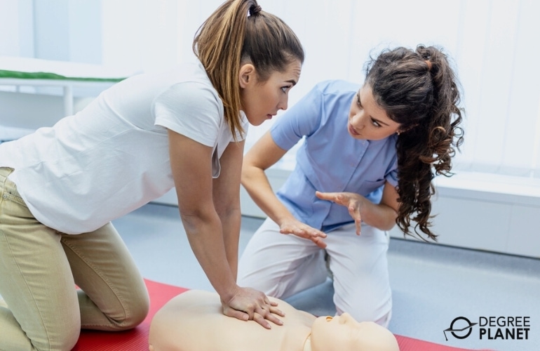 Nursing Instructor guiding a nurse trainee