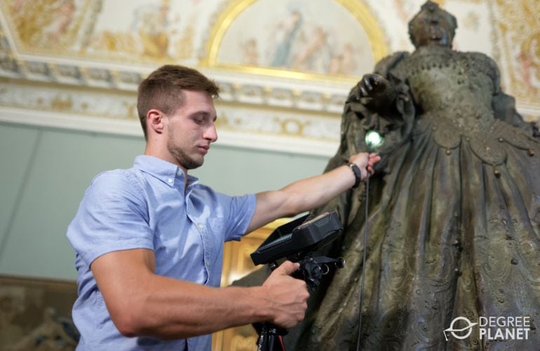 Museum Technician working on the lightings of sculpture displays