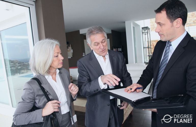 Real Estate Broker discussing an agreement contract with clients