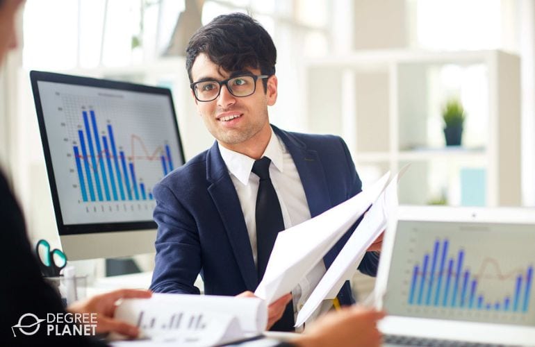 Financial Manager preparing business activity reports