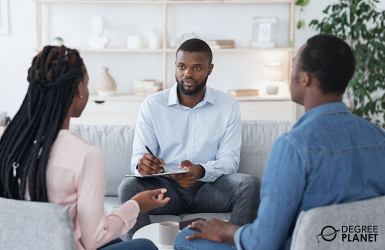 Marriage and Family Therapist discussing with couple