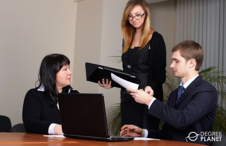 Legal Assistant reminding lawyers of upcoming meeting
