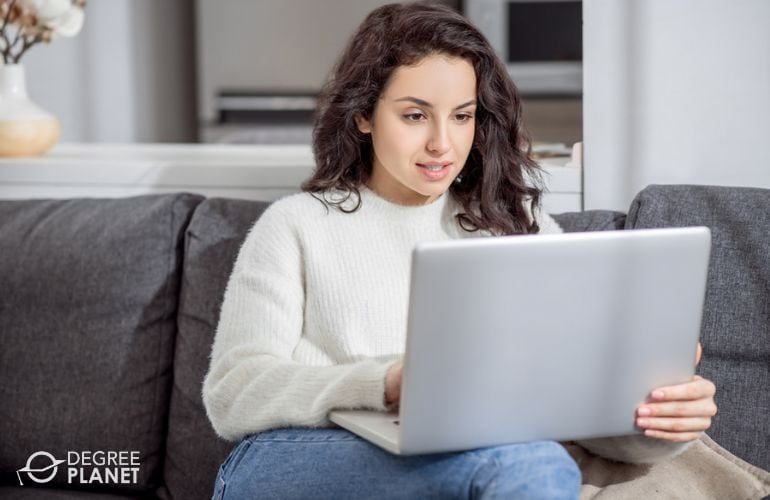 Woman taking Masters in Finance online